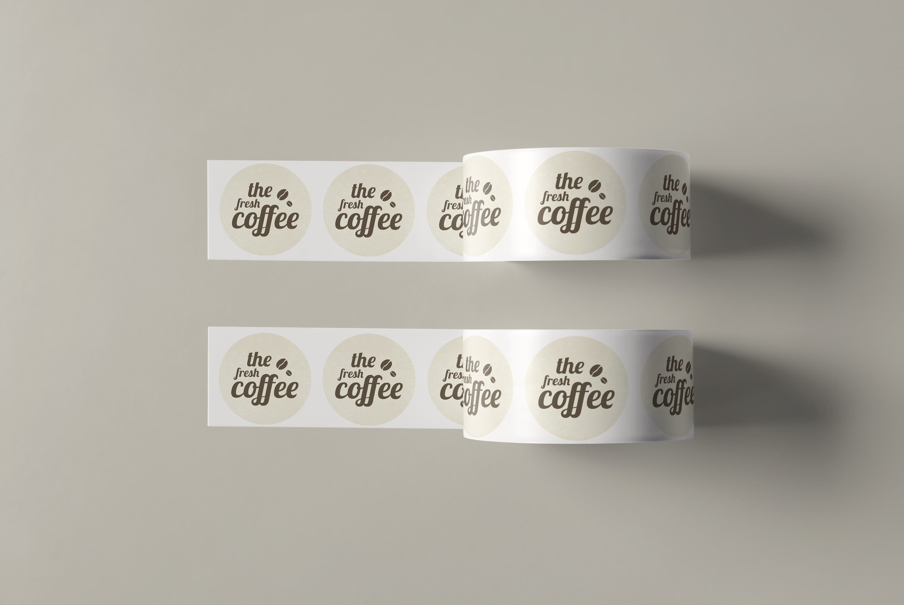 Fresh coffee round labels on two rolls.