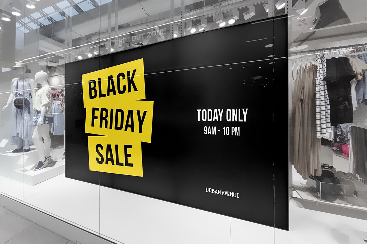 Big indoor poster inside a shop window promoting a black friday sale.
