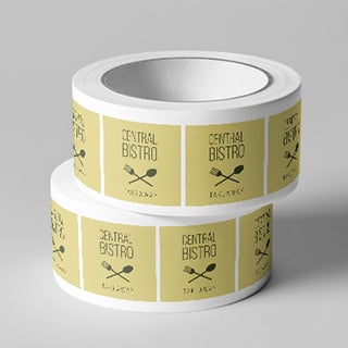 Two rolls of square labels stacked on top of each other, to illustrate Roll Labels printing.