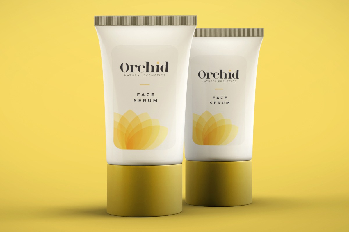 Two cosmetics packaging tubes with Cut Sheet Labels on yellow background.