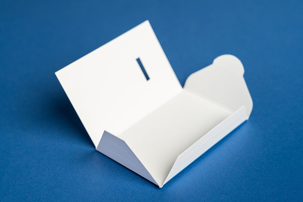 Image showing half assembled Card Sleeve Envelope Fold-Over Tuck laying on the flat surface.