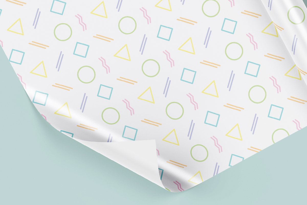 White custom Wrapping Paper with design featuring different colorful shapes.