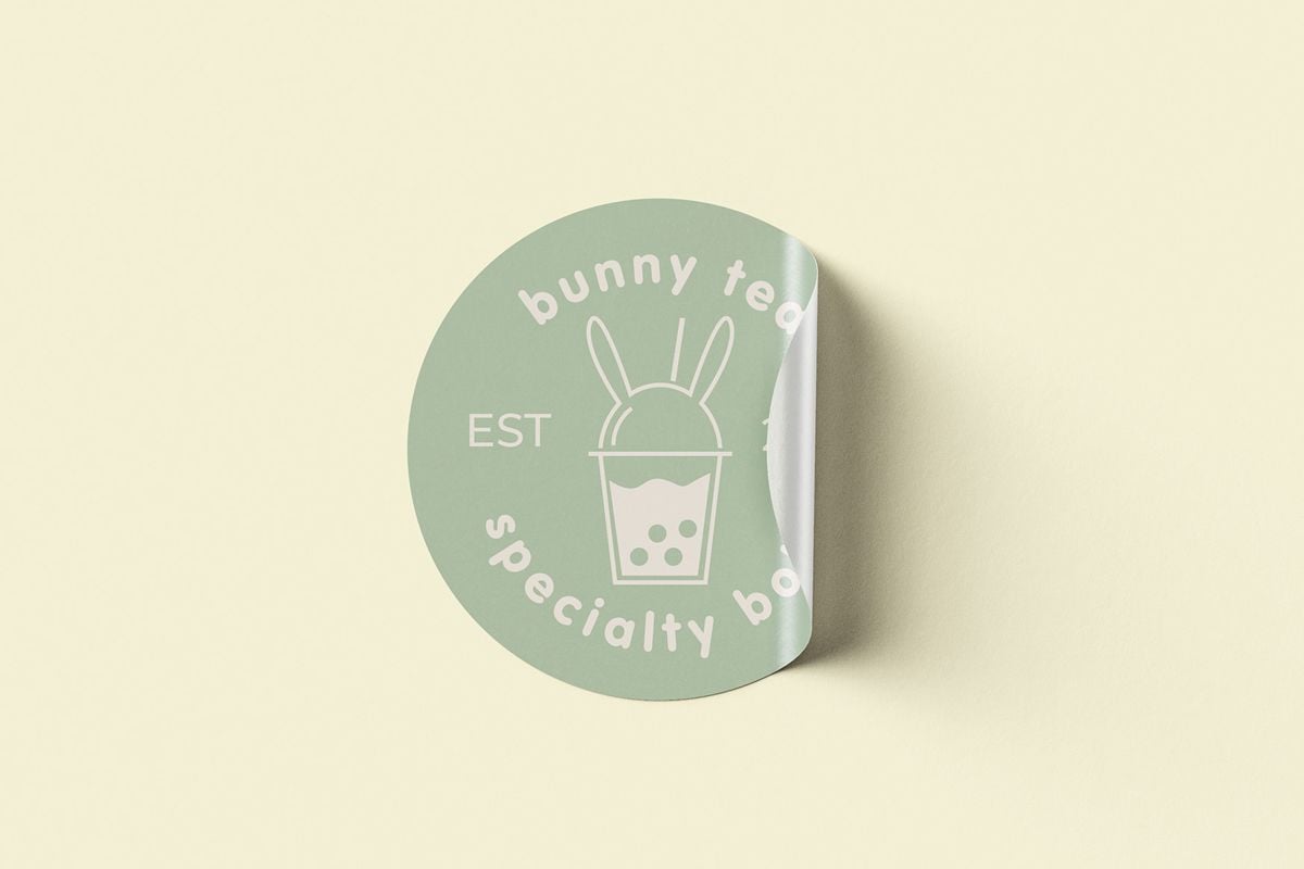 Example of graphic design trends for 2022 –candy colored packaging label with plastic soda glass that has bunny ears on the lid