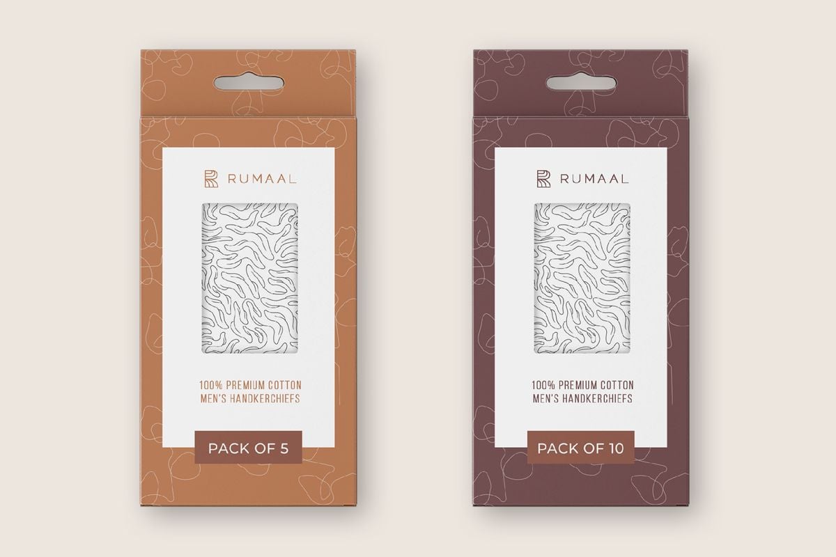 Two small boxes with a clothing packaging design applied.