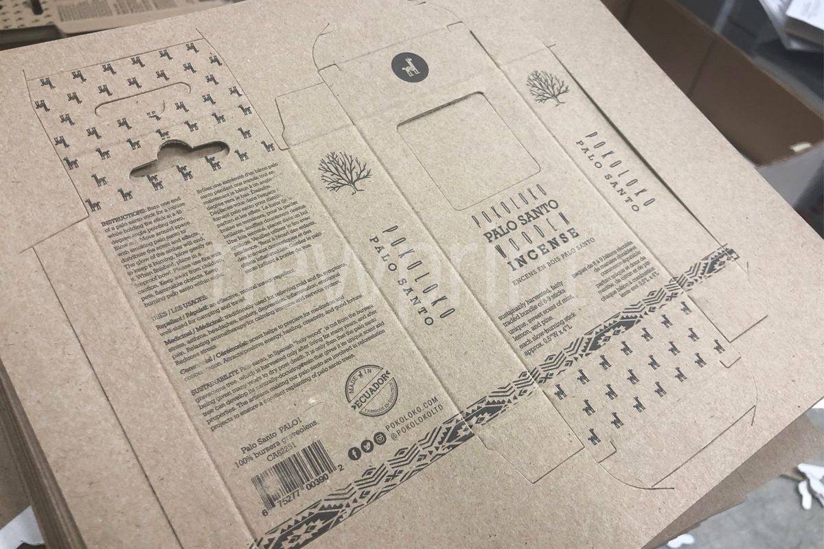 ECMA Standards - A sheet of kraft paper with a box design printed on it with visible box cut lines.