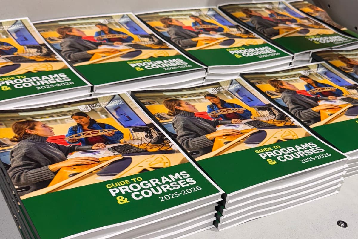 A large stack of high-quality books printed in full color.