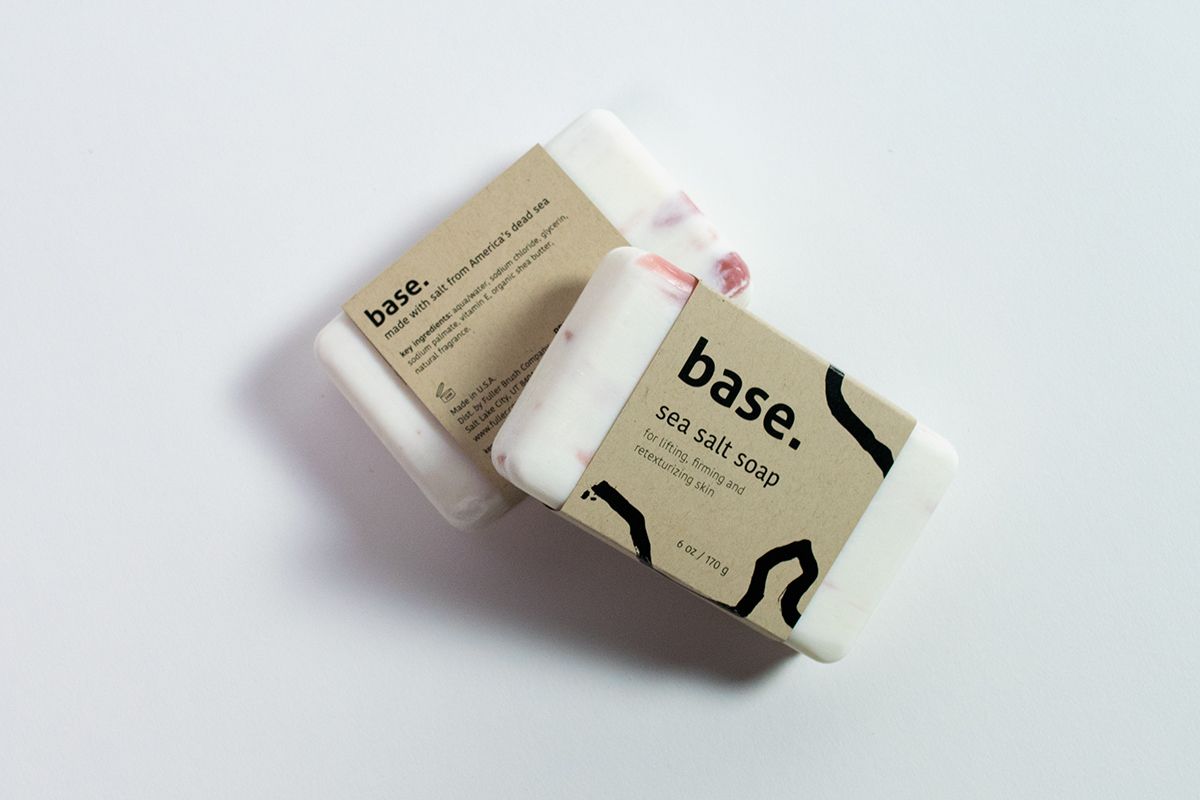 Two soaps with packaging sleeves that have sustainable packaging design