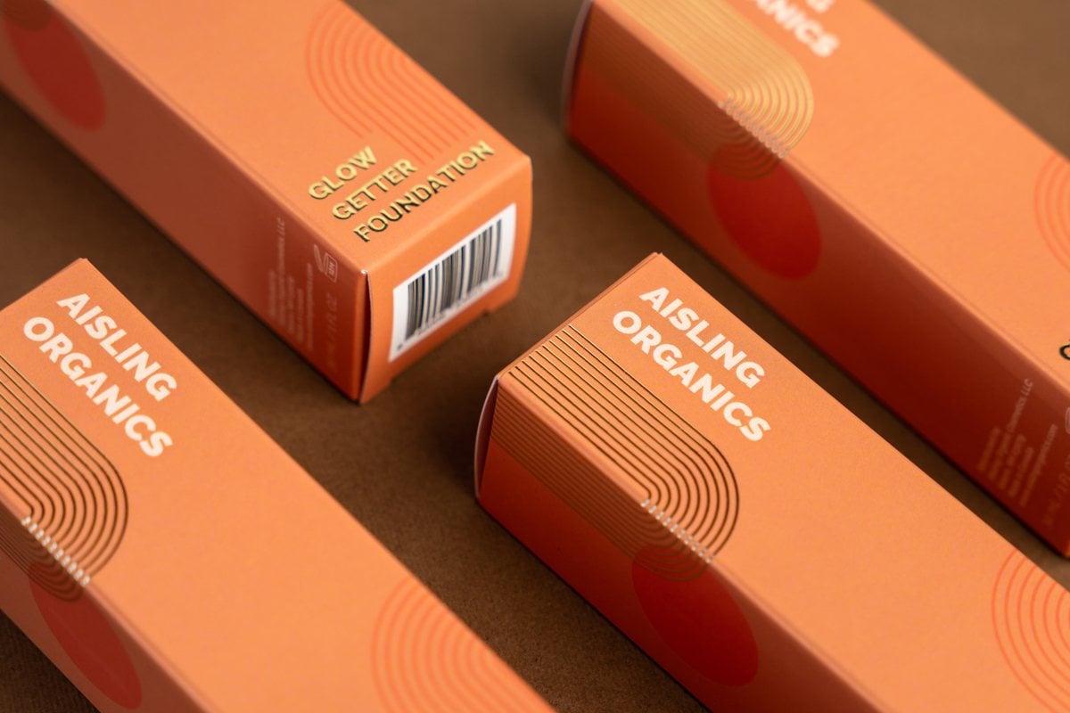 Four orange boxes showing the elegance of custom packaging solutions.