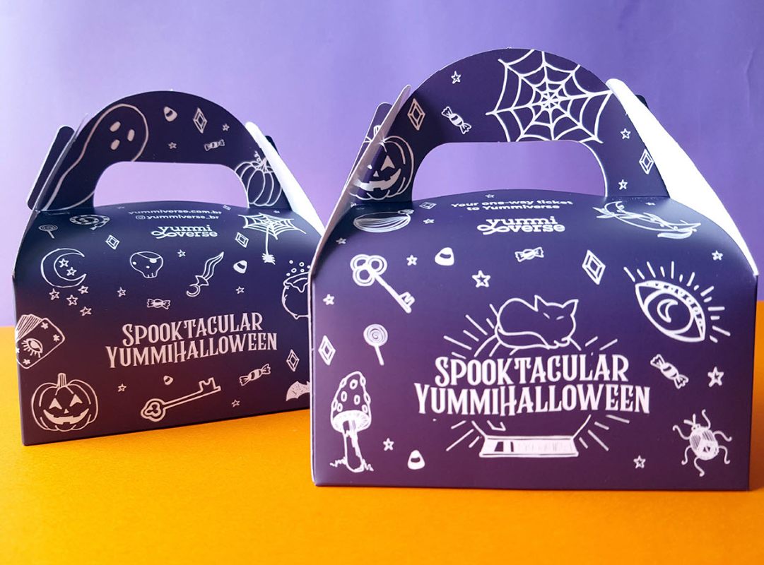 Halloween candy packaging boxes with the witchy design on them in purple and white.