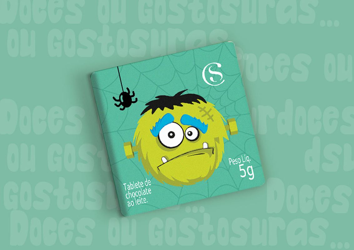 Green Halloween candy packaging with cobweb in the background and Frankenstein's monster in the front.