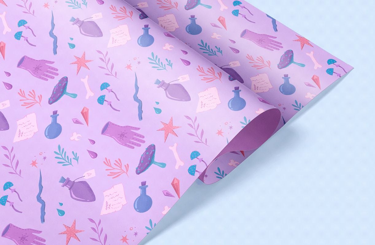 Light purple Halloween wrapping paper with witchy design.