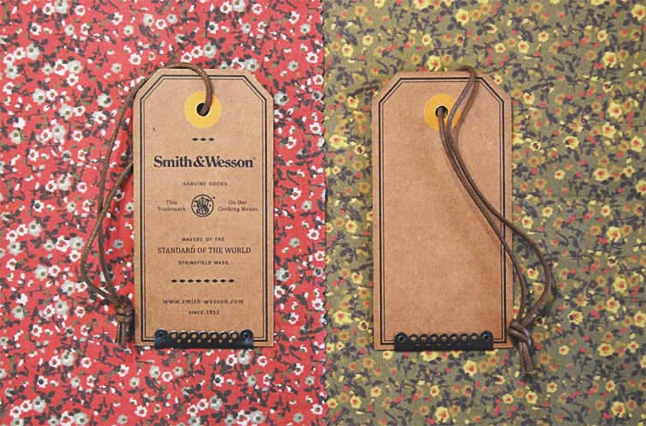 One of the hang tag examples on the kraft paper with front and back on the different backgrounds.