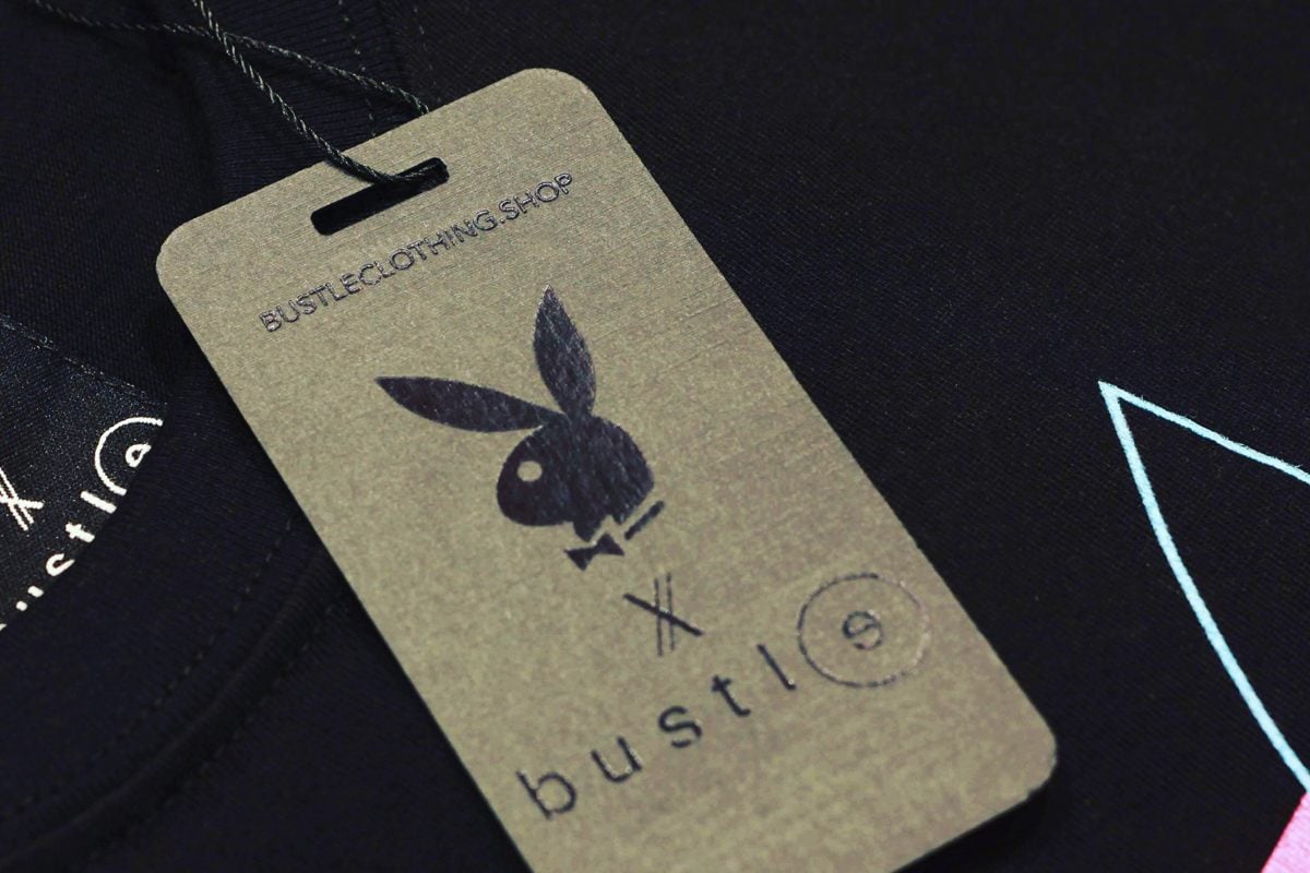 Custom printed hang tag on black linen.