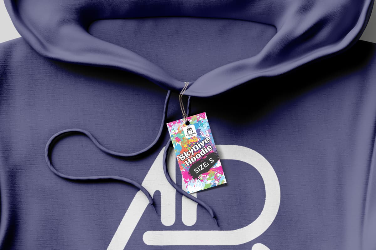 Rectangular colorful hang tag on a purple hoodie.