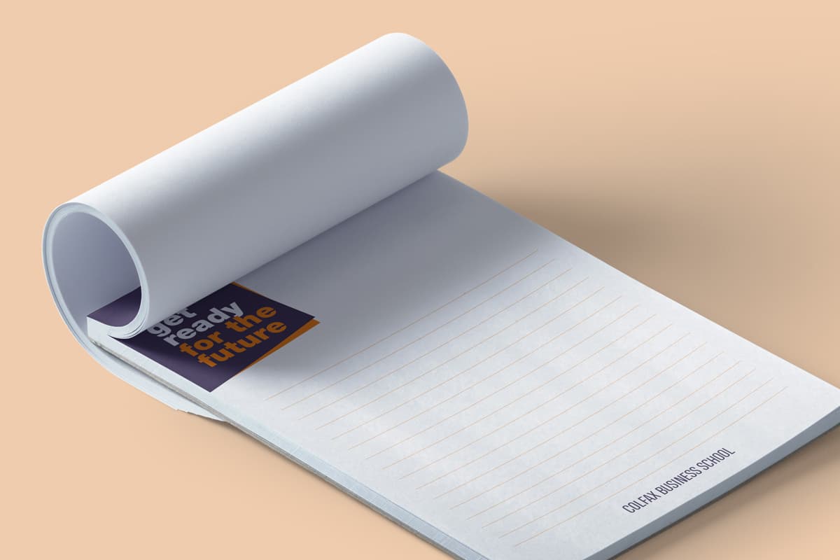 Image showing opend notepad with logo and half of the pages folded.