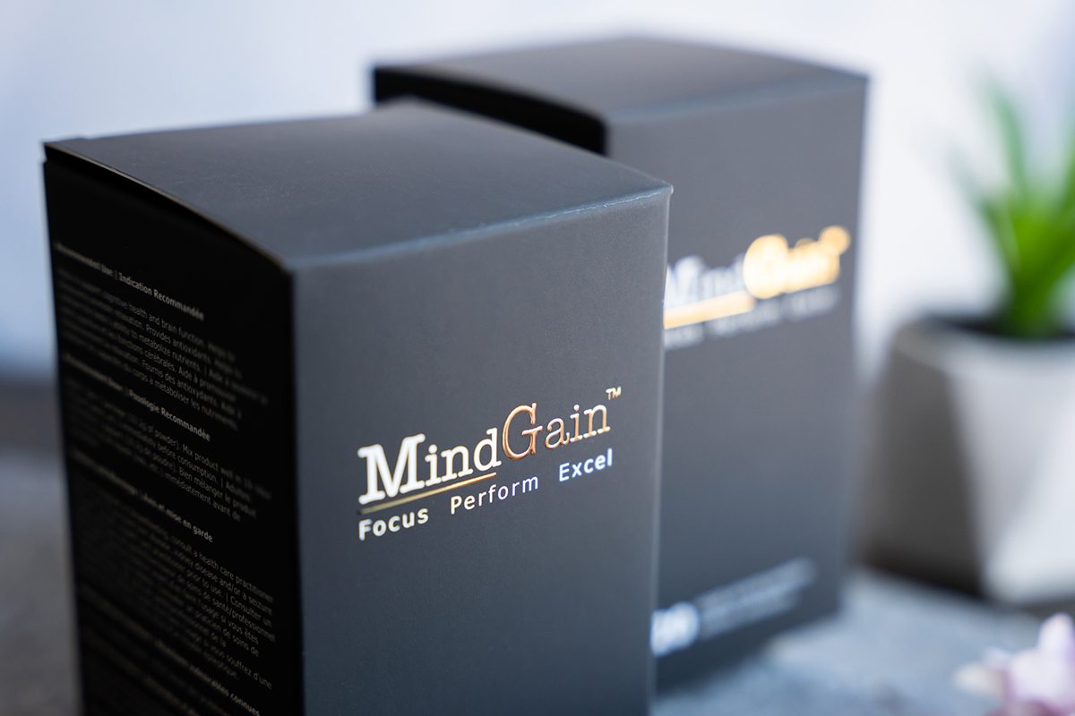 Custom pharmaceutical packaging with elegant black and gold design.
