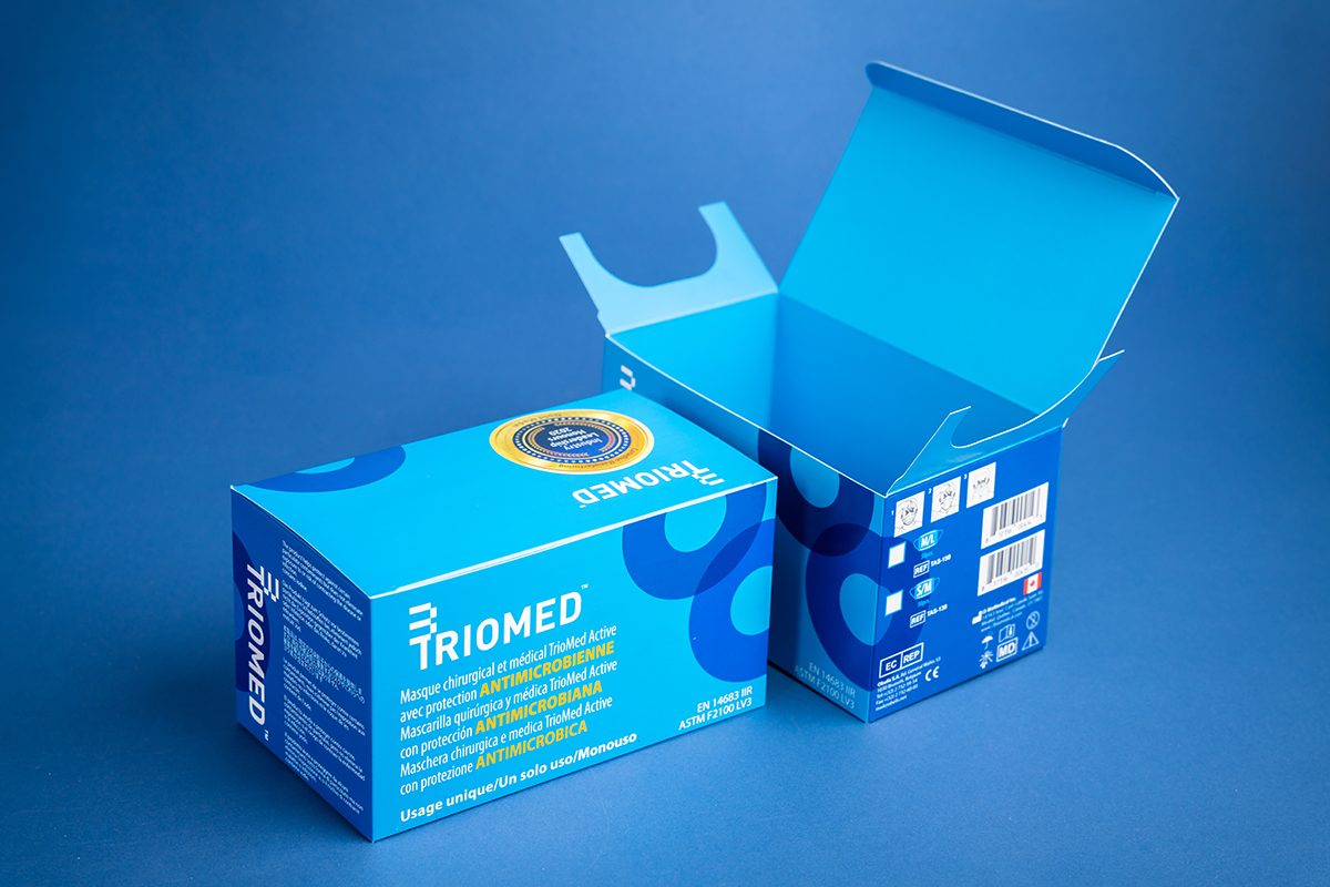 Two custom pharmaceutical packaging boxes, one open and one closed.