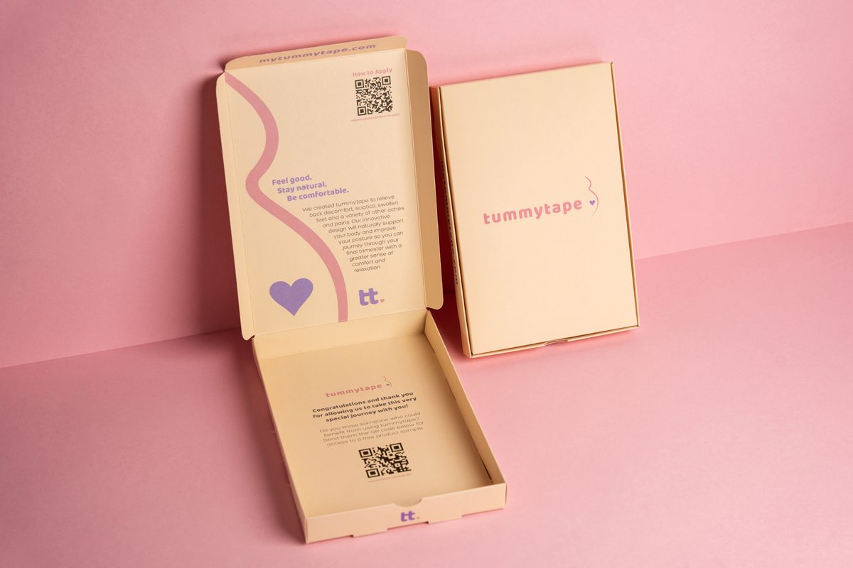 Two custom pharmaceutical packaging boxes, one open and one closed, with pastel colors and simple but effective design.