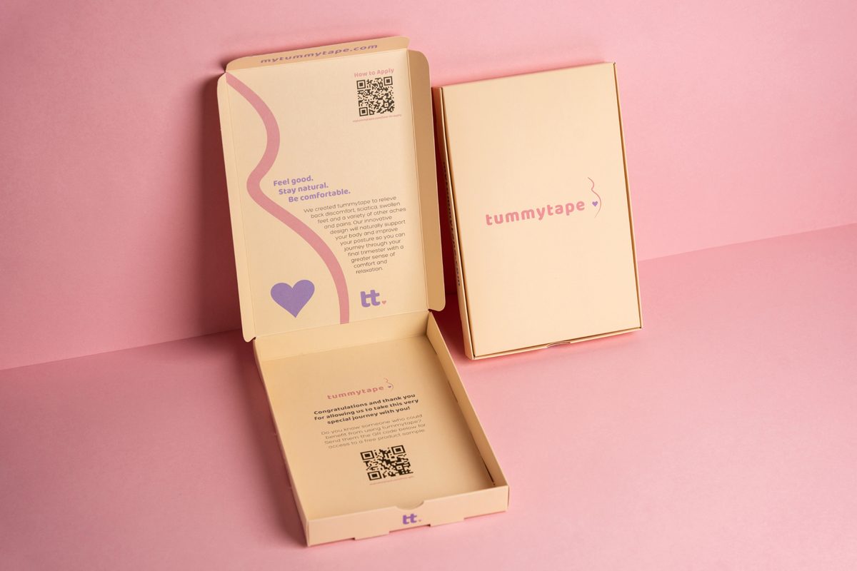 Two custom pharmaceutical packaging boxes, one open and one closed, with pastel colors and simple but effective design.