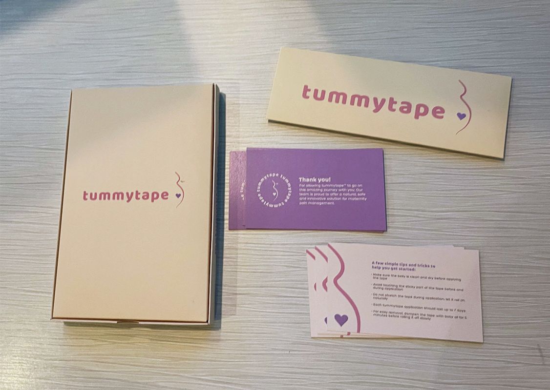 Spot color vs CMYK, a box, front and back side of business cards and a sleeve, all printed with Pantone colors.