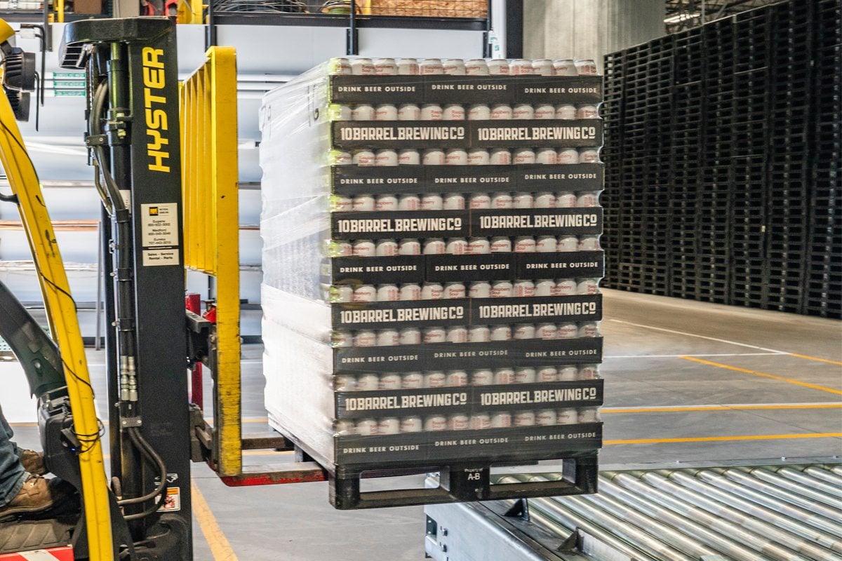 Packaging solutions - pallet of beer can packages on a forklift.