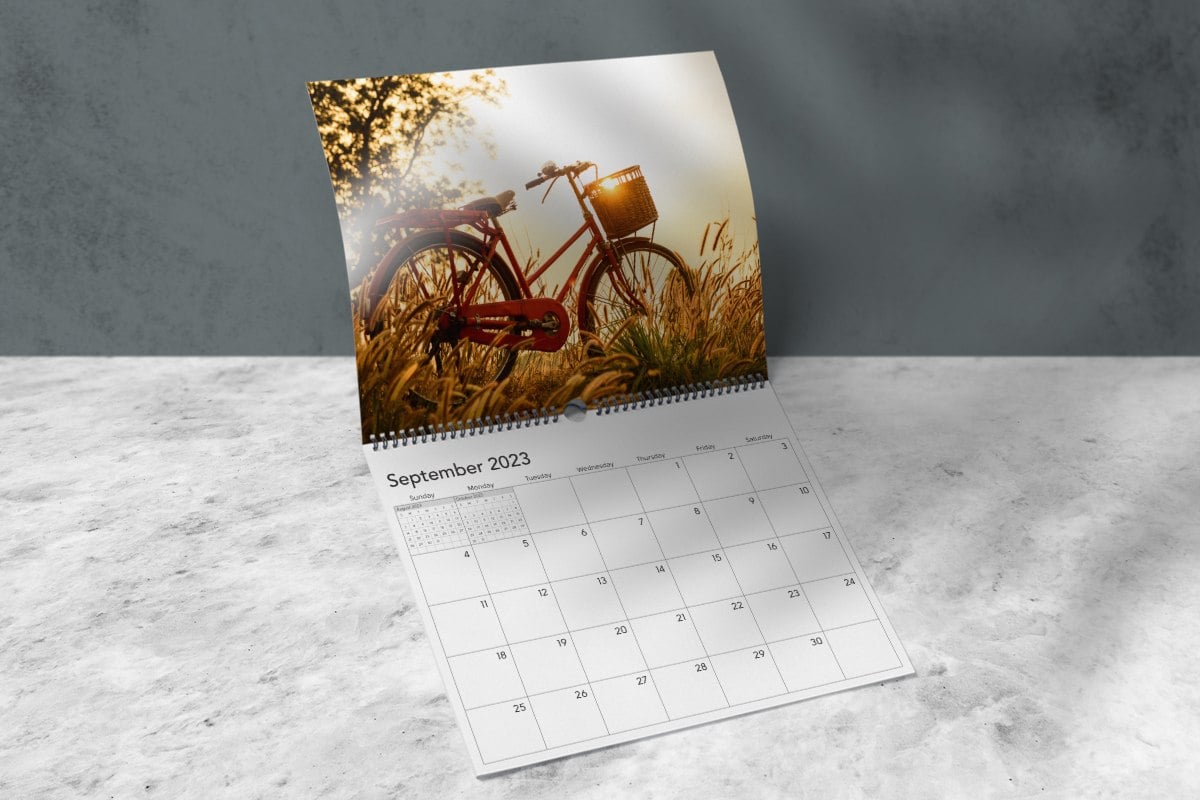 Image showing an open Wall Calendar with bicycle image on it.